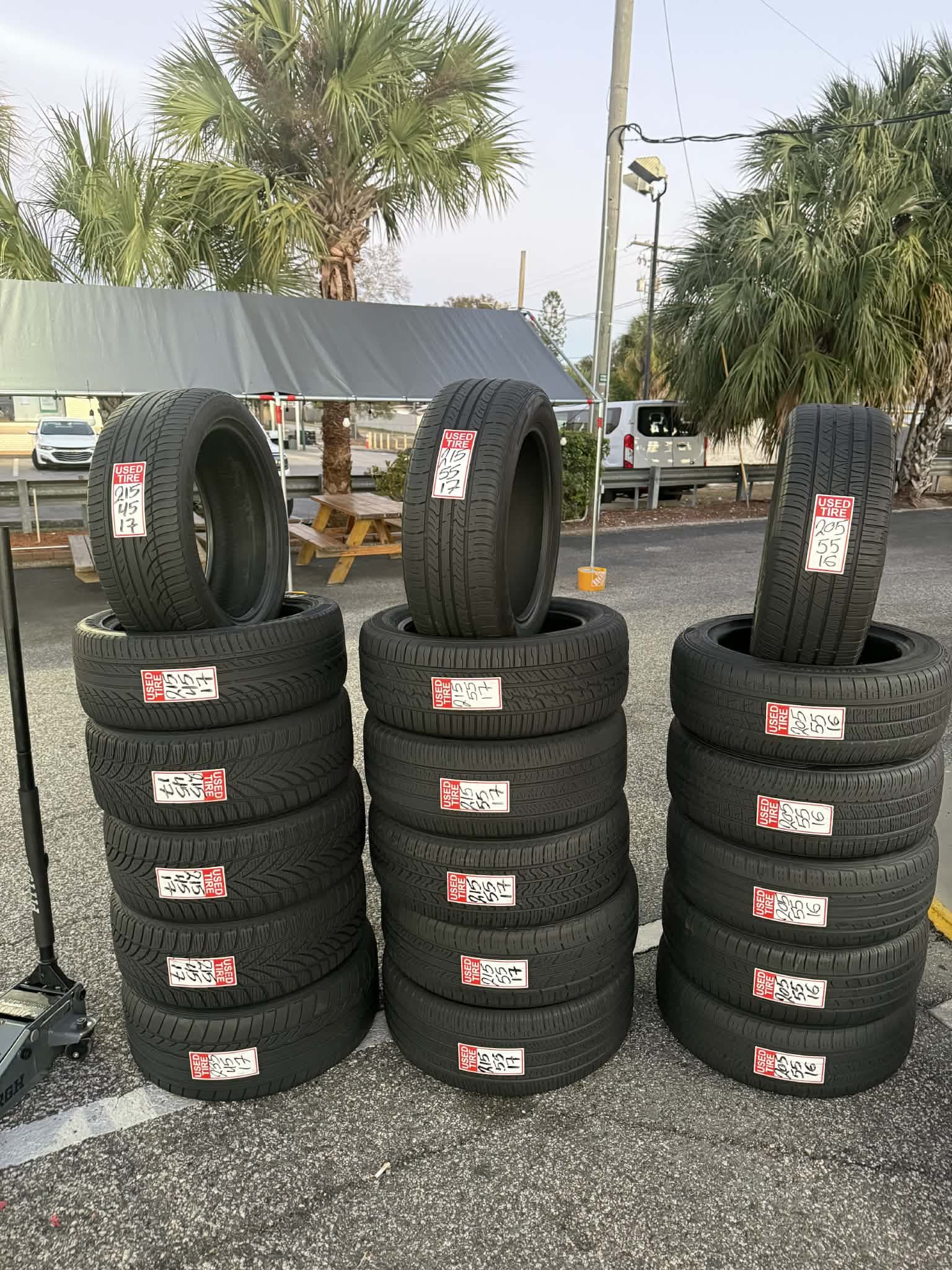 Used tire inventory displayed outside OneStop Tire Shop